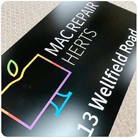 custom sign with white text and full color logo on black background